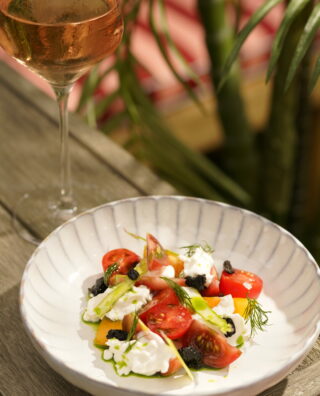 Salad with glass of rosé